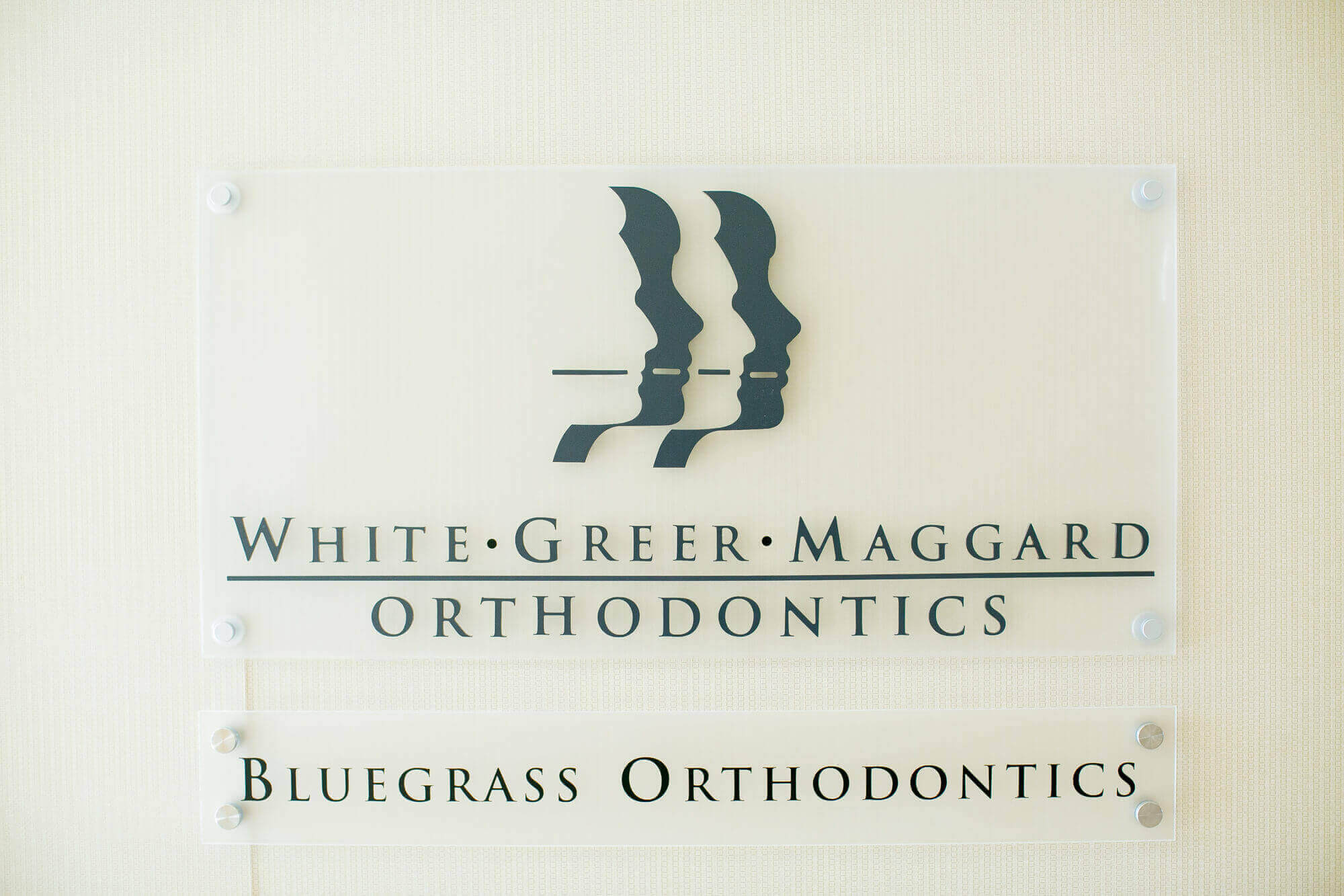 White, Greer & Maggard glass sign